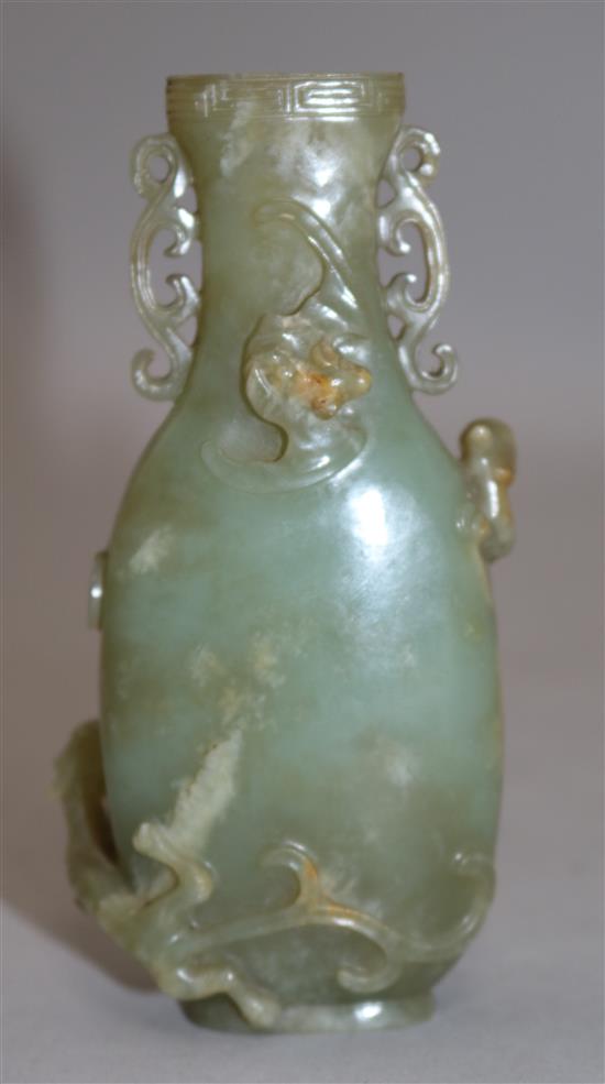 A Chinese archaistic celadon jade vase, Qianlong / Jiaqing period, 11.4cm